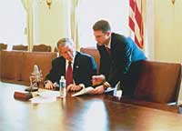 President Bush recording the weekly radio address to the nation.