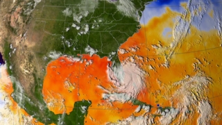 Sea surface temperature with clouds overlaid showing the first half of the 2005 hurricane season  (no storm tracks)