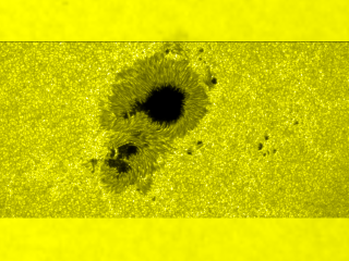 Now we see the same sunspots through the high-resolution optical camera on Hinode.  