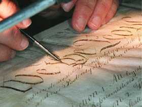 close-up of conservator working on Constitution