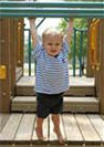 Boy on climbing equipment