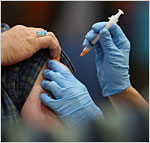 Flu vaccine administered through a syringe