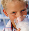 Boy drinking glass of milk