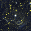 This composite image shows Z Camelopardalis, or Z Cam, a double-star system featuring a collapsed, dead star, called a white dwarf, and a companion star, as well as a ghostly shell around the system