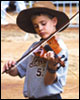 [Photo: Little boy in big hat playing the violin.]