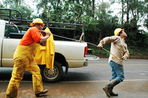 Lineman worked through wet, stormy weather to repair the co-op's circuits.