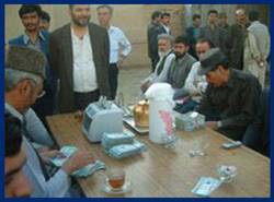 Photo: Old Afghanis are exchanged for the new currency printed by the country’s Central Bank.