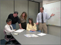 Photo showing a group discussing opportunities for using DER and CHP systems