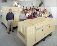 Photo of small modular biopower system with development team