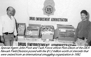 photo - Special Agent John Post and Task Force officer Ron Dixon of the DEA Newark Field Division posed with the $1.2 million worth of steroids that were seized from an international smuggling organization in 1992.