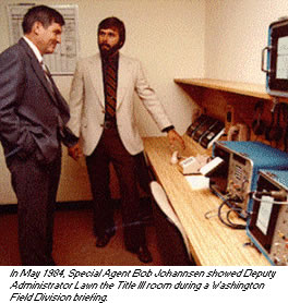 photo - In May 1984, Special Agent Bob Johannsen showed Deputy Administrator Lawn the Title III room during a Washington Field Division briefing.