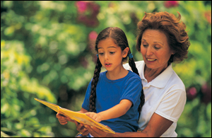 Picture of older woman with a child reading