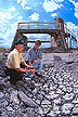 Inspecting a dry stream channel below a 15-food flume