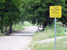 Turn Around, Don't Drown sign at a low water crossing