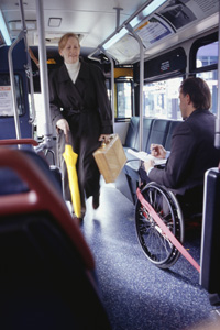 A picture of a woman getting on a bus