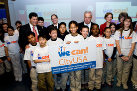 Children presenting city sign to Boston mayor