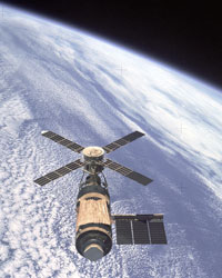 An overhead view of the Skylab Orbital Workshop in Earth orbit as photographed from the Skylab 4 Command and Service Modules (CSM) during the final fly-around by the CSM before returning home.