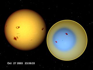 Two large sunspot groups move across the solar disk.
