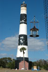 Workers at the Cape Canaveral Lighthouse remove the lamp room.