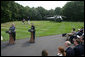 President George W. Bush listens as Afghanistan President Hamid Karzai addresses the media at a joint press availability Monday Aug. 6, 2007, at Camp David near Thurmont, Md., thanking the American people for all that they have done for Afghanistan. White House photo by Chris Greenberg