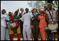 President George W. Bush and Mrs. Laura Bush stands with the Kankouran West African Dance Company after delivering remarks during a ceremony marking Malaria Awareness Day Wednesday, April 25, 2007, in the Rose Garden. "The American people, through their government, are working to end this epidemic,"said President Bush. "In 2005, President Bush announced the President's Malaria Initiative -- a five-year, $1.2 billion program to combat malaria in the hardest-hit African nations." White House photo by Eric Draper