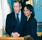 Secretary Rice and Russian Foreign Minister Lavrov shake hands at podium 