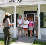 Ranger leading tour of the main ranch house.