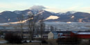 Snow covered mountains surrounding Grant-Kohrs Ranch.