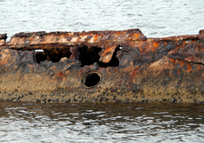 Photo of The rusted hull of the USS Utah