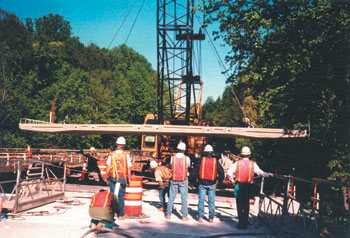 Photo of new deck slab being lowered by a crane Photo: All photographs courtesy of EFLHD Construction Office