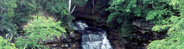 Chapel Falls begins its cascades into Chapel Lake below, one of many waterfalls in Pictured Rocks National Lakeshore.