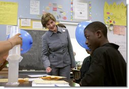 Mrs. Laura Bush watches a student demonstrate an experiment with static electricity and a balloon at the New Orleans Charter Science and Mathematics High School Thursday, April 19, 2007, in New Orleans, La. Originally created as a half-day program in 1992, the program reorganized itself as The New Orleans Charter Science and Mathematics High School after Hurricane Katrina sent the city’s school system into a state of crisis. White House photo by Shealah Craighead