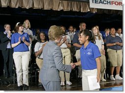 Mrs. Laura Bush thanks 11th grade student Ashley Joplin, who introduced the First Lady, at the New Orleans Charter Science and Mathematics High School Thursday, April 19, 2007, in New Orleans, La. "According to the United States Department of Education, more than 1,000 private and public schools in the Gulf Coast region were damaged or destroyed," said Mrs. Bush. "Today, 94 percent of the schools in Louisiana have reopened. In New Orleans, 58 public schools are now up and running." White House photo by Shealah Craighead