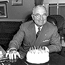 President Truman celebrates his birthday with a cake and candles.