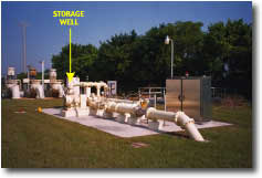 photo of wellhead piping, valves, and control system for an ASR well