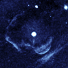 This enhanced image from the far-ultraviolet detector on NASA's GALEX shows a ghostly shell of ionized gas around Z Camelopardalis, a binary, or double-star system featuring a collapsed, dead star known as a white dwarf, and a companion star