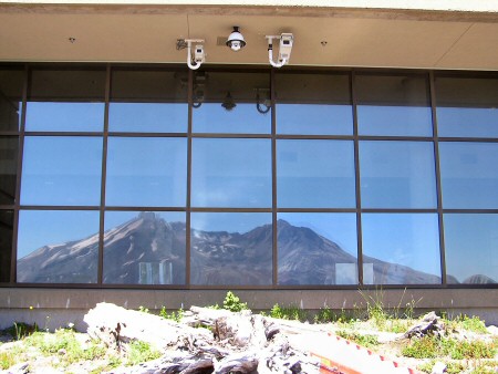 [ Photograph ] Looking at the Mount St. Helens VolcanoCams under the eaves of the Johnston Ridge Observatory. USDA Forest Service photograph by D. Lapcewich.