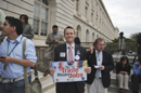 Trade Rally participants holds sign promoting trade=jobs