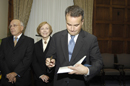 Assistant Secretary Chris Padilla signs the Secretary's book