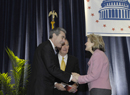 Secretary Carlos Gutierrez is greeted at the National Hispanic Leadership Summit by Texas Senator Kay Bailey Hutchinson