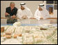 President George W. Bush listens to plans for the future of Abu Dhabi during a tour Monday, Jan. 14, 2008, of the Saadiyat Island Cultural District Exhibition and Masdar Exhibition at the Emirates Palace Hotel. White House photo by Eric Draper