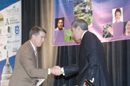 Secretary Gutierrez shakes hands with keynote speaker