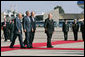 President George W. Bush is flanked by Israel’s President Shimon Peres, left, and Prime Minister Ehud Olmert as they arrive at Tel Aviv’s Ben Gurion International Airport Friday, Jan. 11, 2008, prior to the departure of Air Force One. White House photo by Chris Greenberg