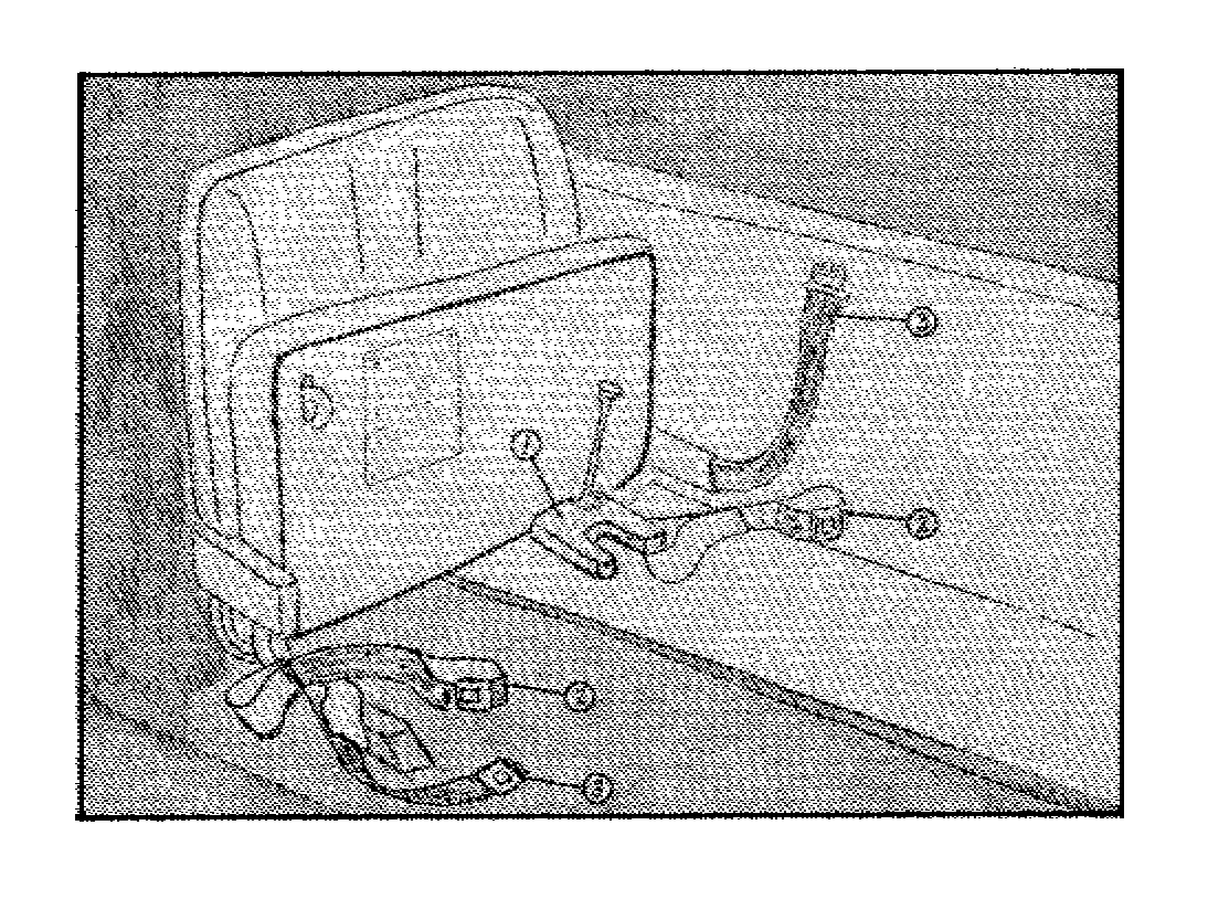 Figure illustrates characteristics of the securement area for front door lift busses.  Area is at a folded bus seat and shows three components to secure the vehicle: 1. Is a wheel clamp mounted to the bottom of the folded seat; 2. Are loop-ended straps (2) one on each side to secure the vehicle at the rear; 3. Is an automotive type lap belt to hold the passenger in place and are mounted on either side of the folded seat.