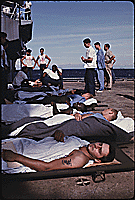 Medical evacuation patients on the deck of the Amphibious assault ship USS Tripoli