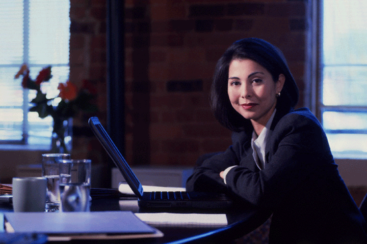 Picture of woman at a computer.