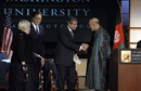 Secretary Gutierrez shakes hands with President Hamid Karzai
