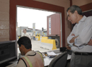 Secy Gutierrez watches an Honduran at work