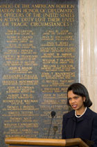 Secretary Rice stands next to the Memorial Plaque during her address at the American Foreign Service Association's [AFSA] Memorial Plaque dedicating ceremony, Friday, May 5, 2006 at the State Department in Washington. The ceremony honors the sacrifice made by Americans who lost their lives in the service of country between 2005 and early 2006. [© AP/WWP]