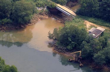 Picture of sediment inflow from a tributary into a stream. 